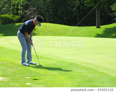 From golf play golfer green color putter putt 85893110