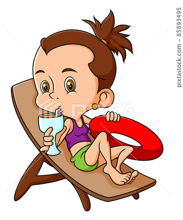 The young girl is enjoy the juice and laying on the chair The young girl is enjoy the juice and laying on the chair 85893495