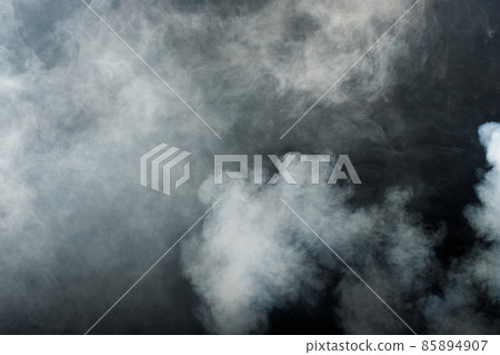 Dense Fluffy Puffs of White Smoke and Fog on Black Background, Abstract Smoke Clouds 85894907