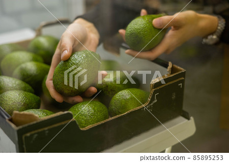 Morning domestic woman in towel on hairs cooking fresh espresso in cups at coffee machine 85895253