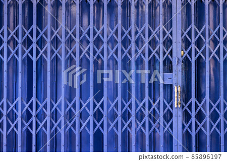 Blue color metal steel foldable door. Pattern of iron super strong and hard to destroy entrance for protecting places 85896197
