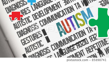 Image of red, green and blue autism awareness puzzles falling over autism text Image of red, green and blue autism awareness puzzles falling over autism text 85898741