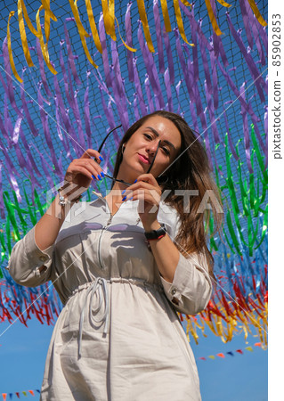 Young woman on festival. Gen z girl enjoying outdoors, expressing positive emotions having fun in park. Millennial generation lifestyle. 85902853