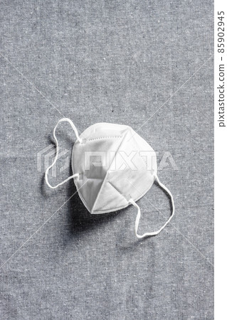 KN95 respirator. Face mask coronavirus protection on canva background. KN95 respirator. Face mask coronavirus protection on canva background. 85902945