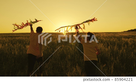 father and son run with kite in hand catching wind n sunset, happy family, boy and dad have fun playing game together in field, travel on weekends, summer vacation countryside, childhood dream fly father and son run with kite in hand catching wind n sunset, happy family, boy and dad have fun playing game together in field, travel on weekends, summer vacation countryside, childhood dream fly 85904221