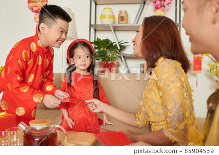 Boy Receiving Red Envelope Boy Receiving Red Envelope 85904539