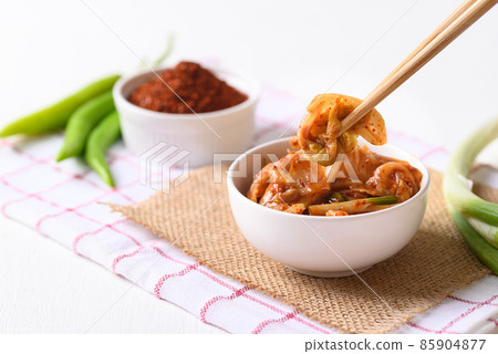 Korean kimchi cabbage in a bowl eating by use chopsticks Korean kimchi cabbage in a bowl eating by use chopsticks 85904877