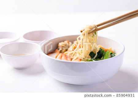 Noodles soup with wonton dumpling and grilled red pork in bowl on white background, Asian food 85904931