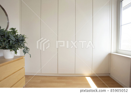 Room with a built in wardrobe white modern design in new house, stylish interior Room with a built in wardrobe white modern design in new house, stylish interior 85905052