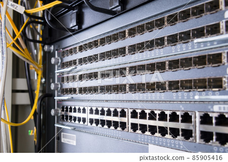 close-up of switch panel with empty ethernet and fiber optics ports 85905416