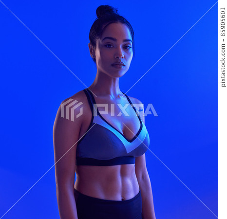 Willpower knows no obstacles. Studio portrait of an attractive young sportswoman posing against a blue background. 85905601