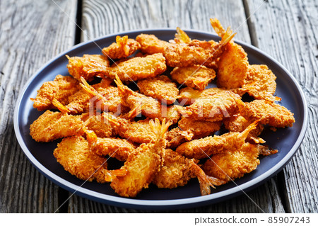 Crispy Fried Butterfly Shrimp on a grey plate Crispy Fried Butterfly Shrimp on a grey plate 85907243