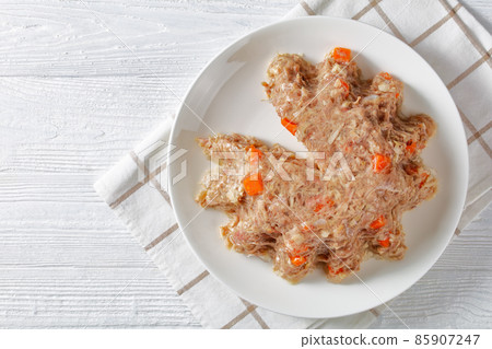 meat aspic, jellied slow cooked meat on a plate meat aspic, jellied slow cooked meat on a plate 85907247