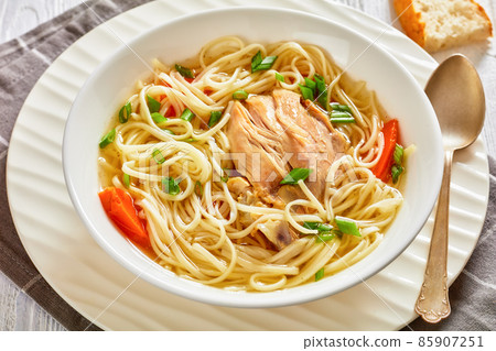 chicken noodle soup with carrots and scallion chicken noodle soup with carrots and scallion 85907251
