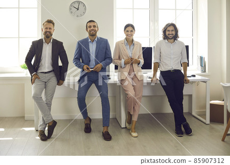 Portrait of smiling diverse employees colleagues pose together show company unity teamwork in office. Happy motivated successful millennial gen z businesspeople at workplace. Bank, finance concept. 85907312