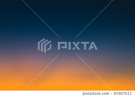 Abstract gradient sunrise in the sky with blue and orange natural background. 85907811