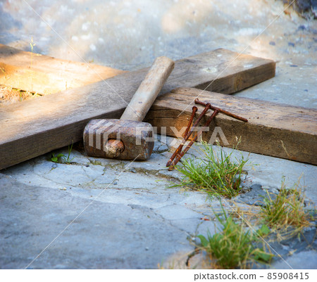 Wooden cross and iron nails Wooden cross and iron nails 85908415