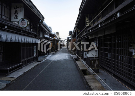Snowy Hida Takayama Old Town at dusk 85908905
