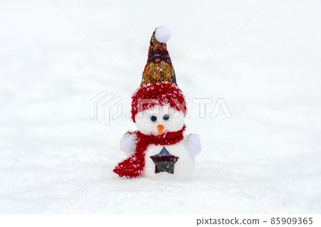 Merry christmas and happy new year greeting card with copy space Happy little snowman in red cap and scarf standing in winter snow background Xmas fairytale Hello January, February concept 85909365