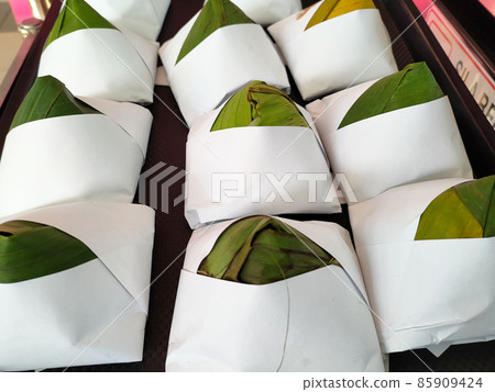 Nasi lemak. Is a signature food in Malaysia. Often eaten as breakfast. Nasi lemak is usually served with sambal, eggs and anchovies. Nasi lemak. Is a signature food in Malaysia. Often eaten as breakfast. Nasi lemak is usually served with sambal, eggs and anchovies. 85909424