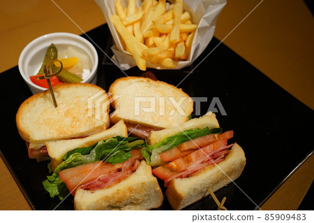 BLT sandwich pickles french fries 85909483
