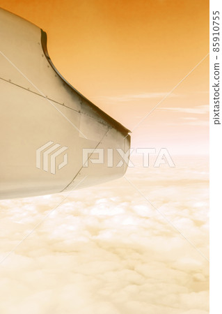 A wonderful view from the window of an airplane Orange sky A wonderful view from the window of an airplane Orange sky 85910755