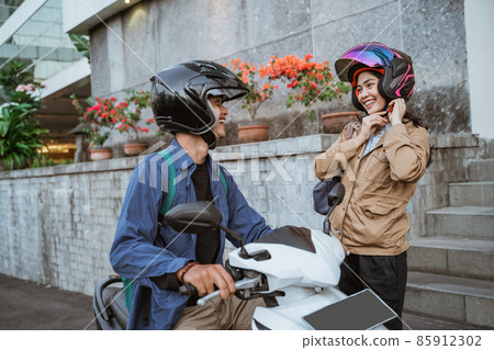 asian man on a motorbike picks up a woman asian man on a motorbike picks up a woman 85912302