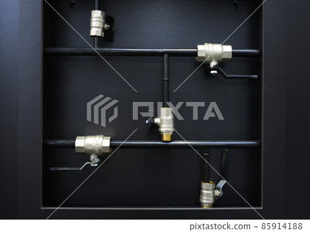 Ball valves placed on a stand. Plumbing equipment Ball valves placed on a stand. Plumbing equipment 85914188