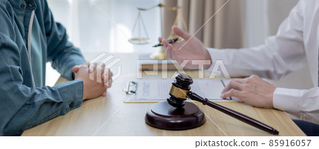 Attorney or judge provides legal advice to the client in the courtroom, Ethics in the courts include justice and impartiality, legal consultant, scales of justice, law hammer, Litigation and justice. 85916057