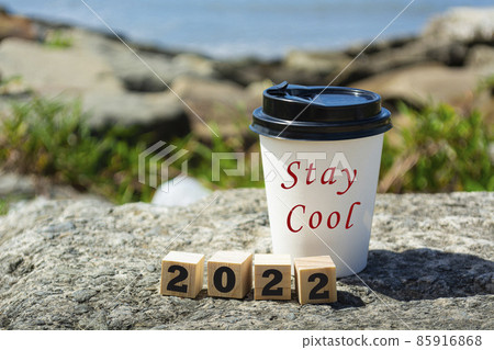 2022 number on wooden block and a disposable coffee cup with text 2022 number on wooden block and a disposable coffee cup with text 85916868