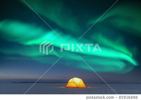 Yellow tent against the backdrop of incredible starry sky 85916898