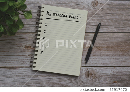 Text on notepad on wooden table Text on notepad on wooden table 85917470