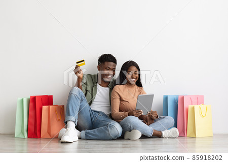 Emotional black family buying stuff online, using digital tablet 85918202