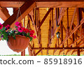 Potted flowers on the background of the wooden roof of the house 85918916