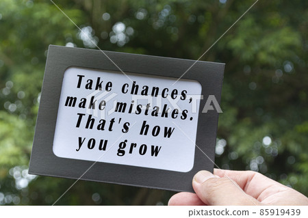 Motivational and inspirational quote on hands holding framed paper Motivational and inspirational quote on hands holding framed paper 85919439