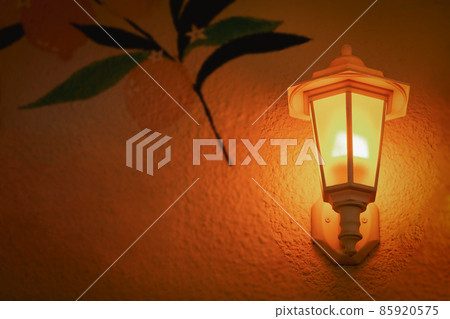 Vintage old street lamp on house wall at night Vintage old street lamp on house wall at night 85920575