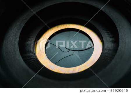 Aperture hole of old mechanical camera. Abstract background. Theme of photo. 85920646