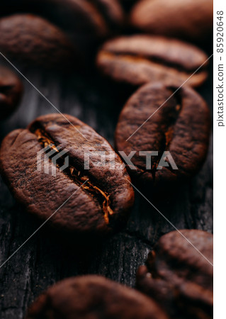 Close-up of coffee beans. Selective focus. Macro photo of coffee on dark textural background 85920648