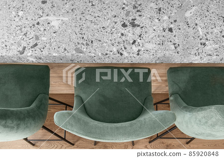Bar counter with three bar stools and the kitchen grey stone effect countertop in minimal apartment interior 85920848