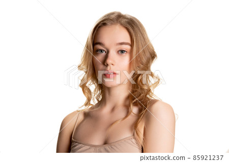 Half-length portrait of young beautiful girl with day makeup isolated over white studio background. Natural beauty concept. Half-length portrait of young beautiful girl with day makeup isolated over white studio background. Natural beauty concept. 85921237