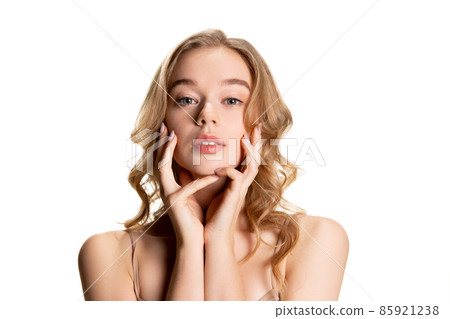 Half-length portrait of young beautiful girl with day makeup isolated over white studio background. Natural beauty concept. Half-length portrait of young beautiful girl with day makeup isolated over white studio background. Natural beauty concept. 85921238
