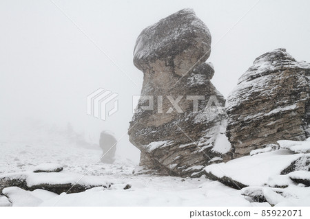 Huge snow-covered free-standing rocks-outliers on the mountains Huge snow-covered free-standing rocks-outliers on the mountains 85922071