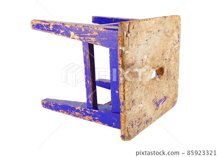 Old wooden stool with peeling blue paint. Loft style chair isolated on a white background. 85923321