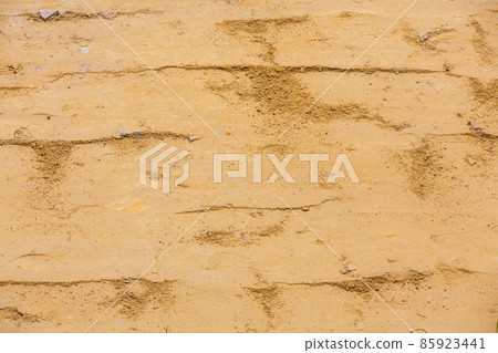 close-up view of rammed sand surface compacted with vibratory plate compactor 85923441