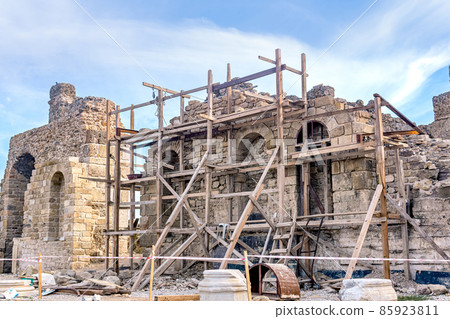 scaffolding around a restored antique building scaffolding around a restored antique building 85923811