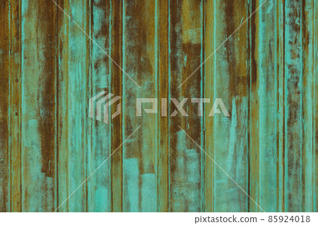 rusted corrugated steel sheet with leftovers of decayed and washed out green paint rusted corrugated steel sheet with leftovers of decayed and washed out green paint 85924018