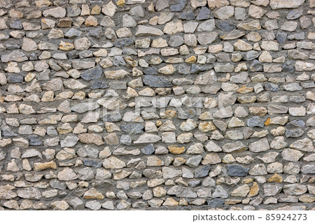 seamless texture of ugly sharp stone wall with concrete between rocks 85924273
