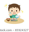 Boy grilled fish eating with a smile 85924327