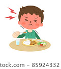 A boy who has a hard time eating curry rice 85924332