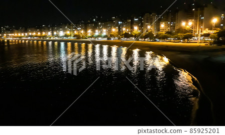Icarai beach in Niteroi. Rio de Janeiro, Brazil, at night. reflections on sea water Icarai beach in Niteroi. Rio de Janeiro, Brazil, at night. reflections on sea water 85925201